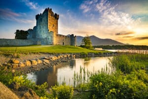 Ancient old Fortress Ross Castle ruin with lake and grass in Ire