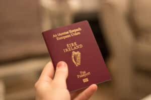 irish passport being held in hand